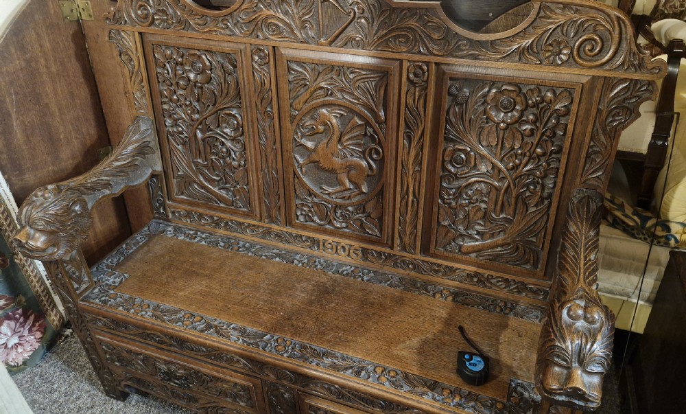 Carved oak Welsh hall seat. View XII