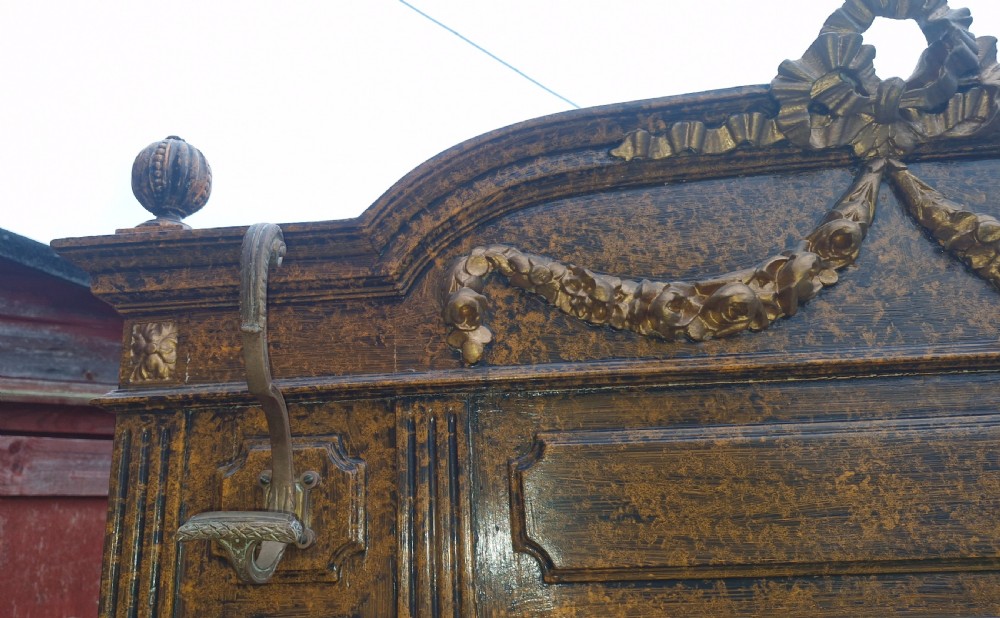A late 19th-century wooden hall stand featuring a central mirror, marble shelf, brass coat hooks, and integrated umbrella drip trays. View VII