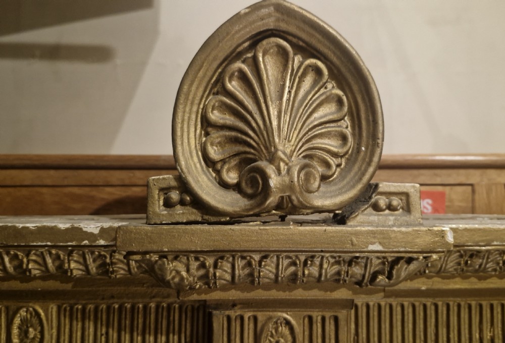 A large 19th-century gold giltwood architectural hall mirror featuring a three-panel design with ornate neoclassical columns, urn motifs, and a central medallion. View XVI