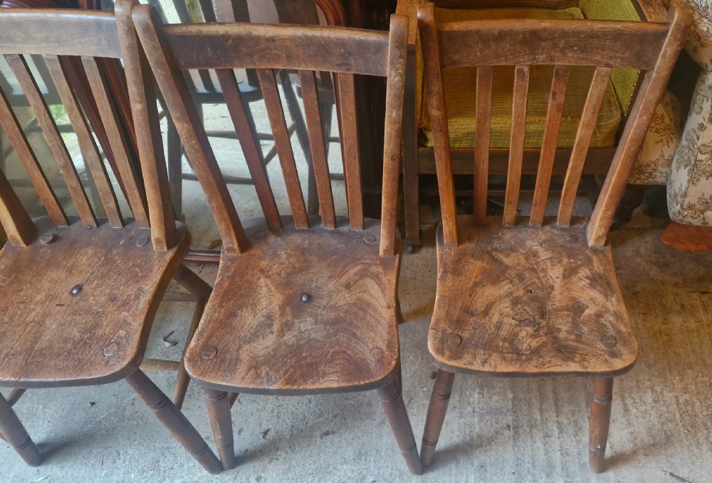 Unusual set of 4 Windsor chairs all with different maker's stamps. View IV