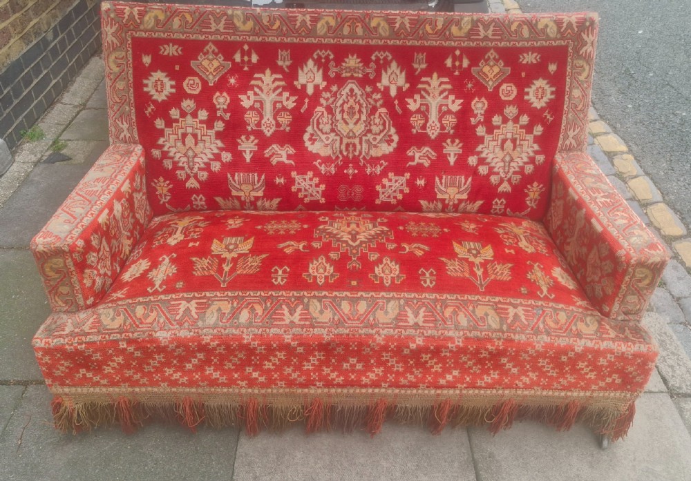 Late 19th century carpet upholstered sofa. 