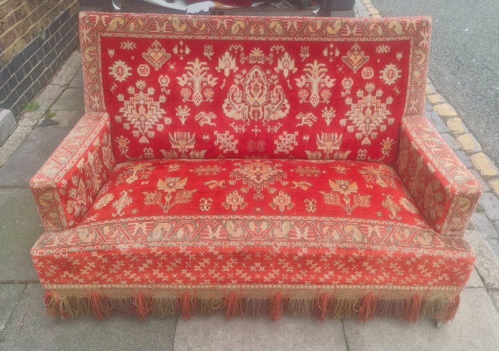 Late 19th century carpet upholstered sofa.  View VI