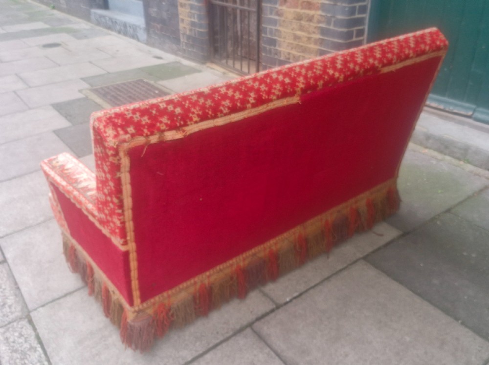 Late 19th century carpet upholstered sofa.  View VIII