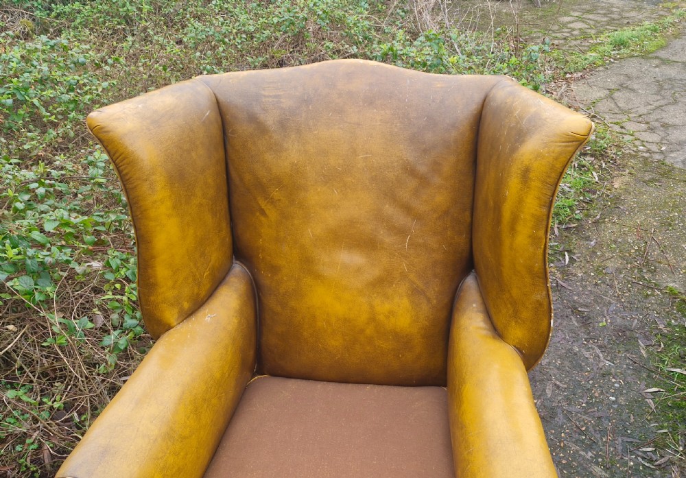 Large upholstered wing back upholstered armchair.  View III
