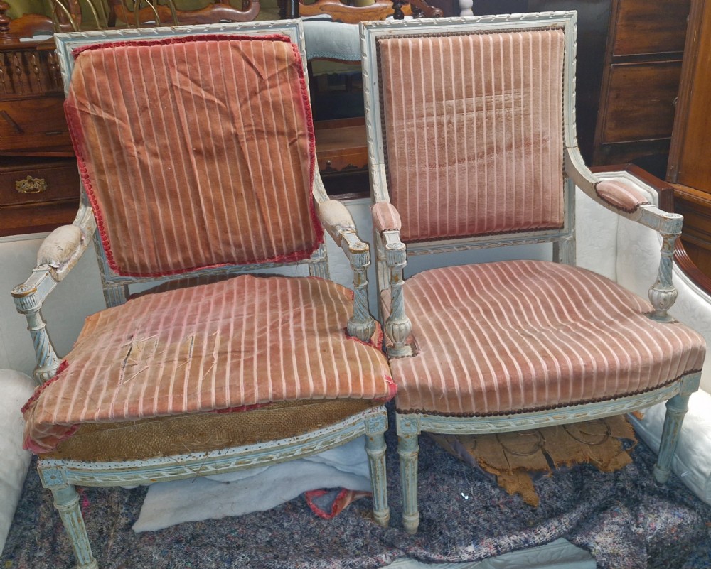 Pair of French upholstered armchairs.