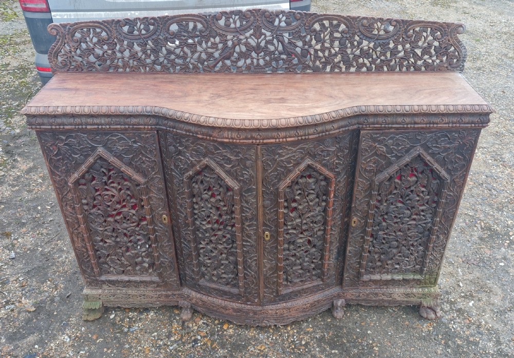 Carved Anglo Indian hardwood 4 door side cabinet. 