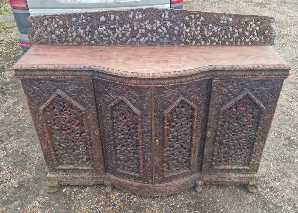 Carved Anglo Indian hardwood 4 door side cabinet.  View VI