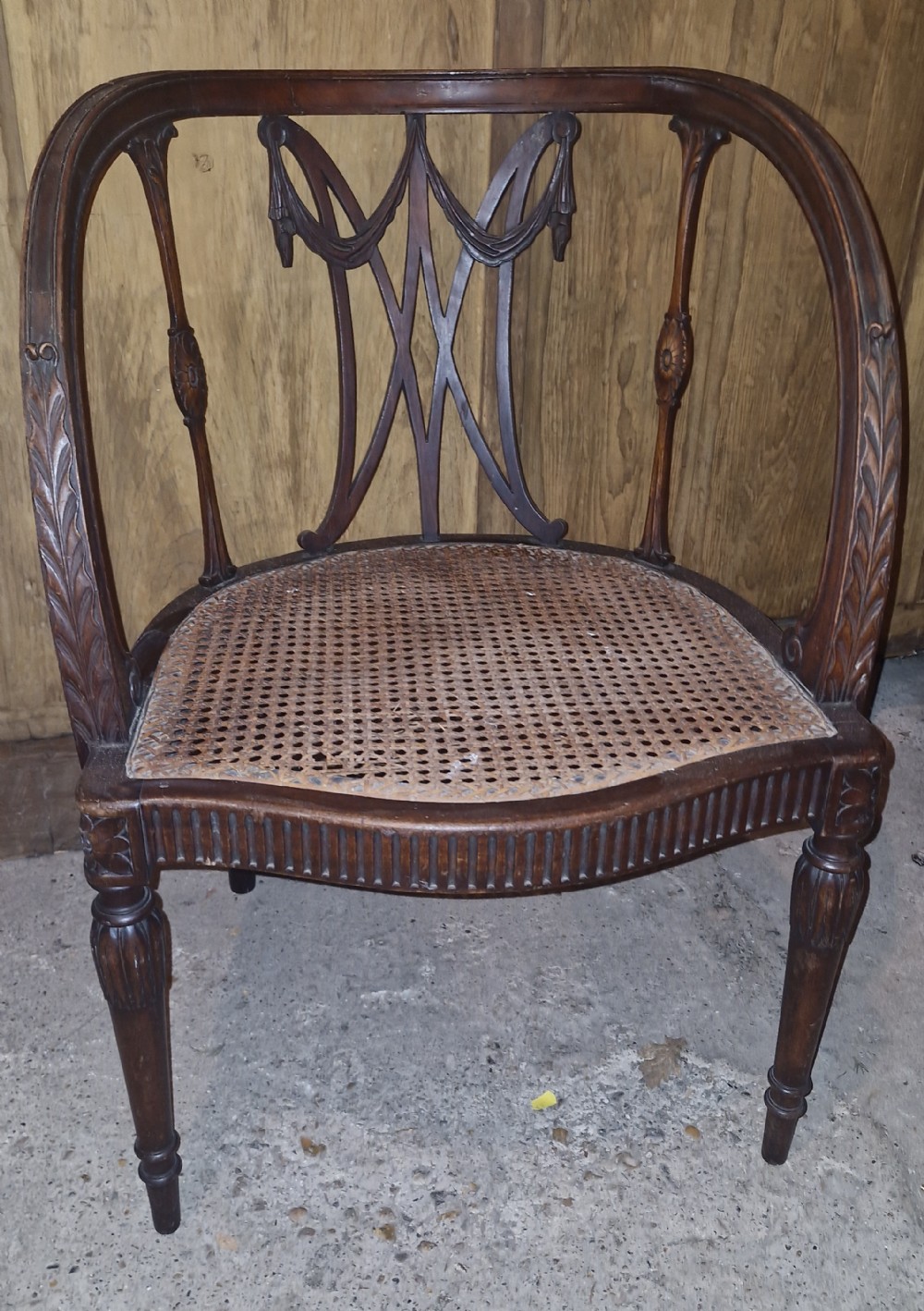 Edwardian carved Mahogany caned armchair. 