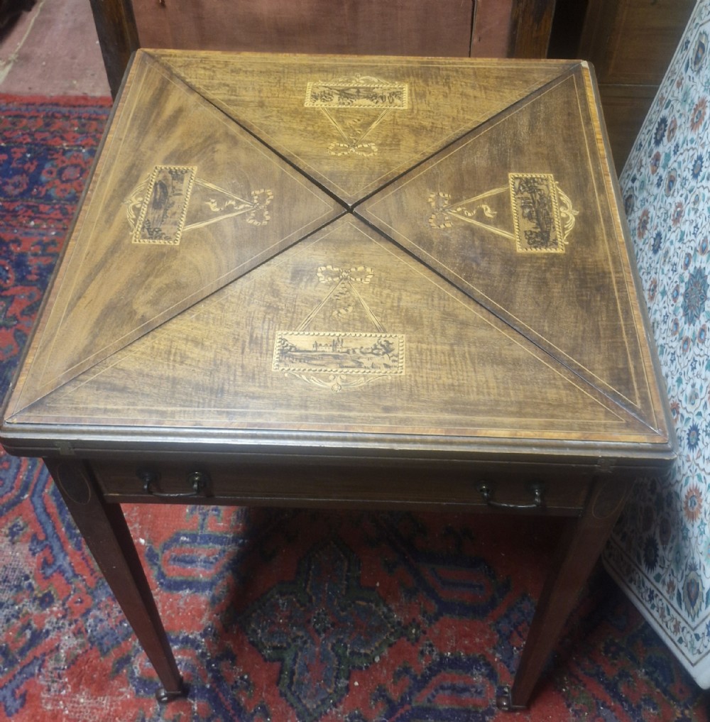 Edwardian inlaid mahogany swivel top games table. 