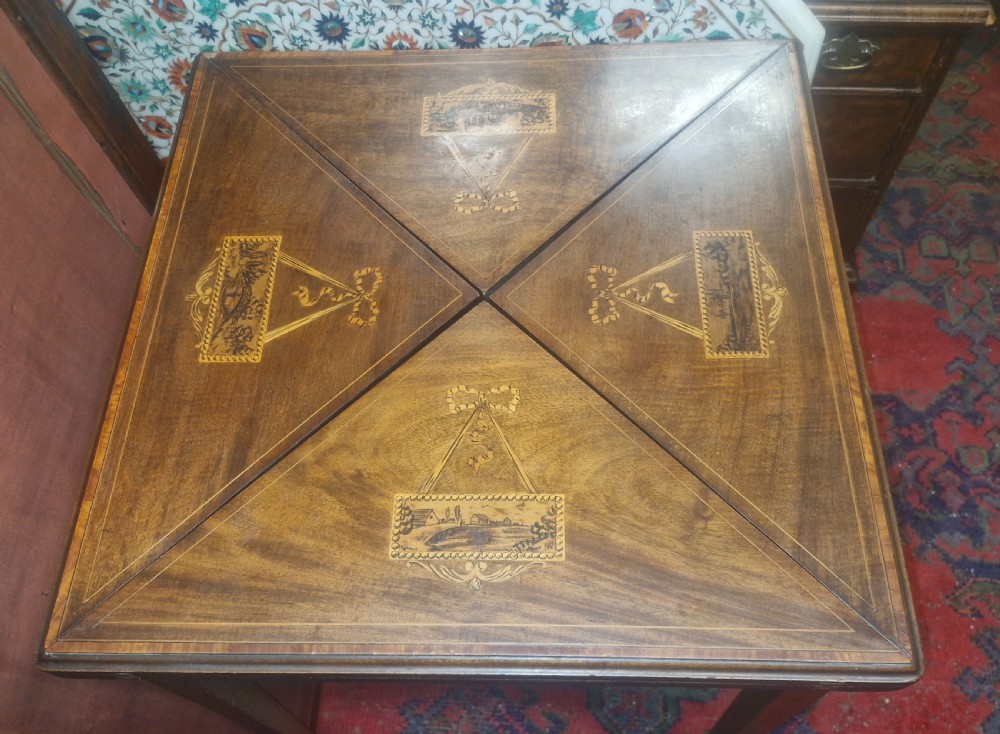 Edwardian inlaid mahogany swivel top games table.  View VI