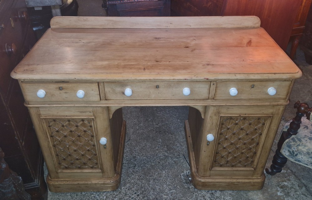Victorian pine kneehole pedestal writing desk, fitted drawers.  View III