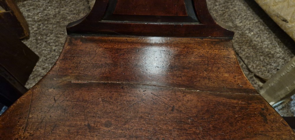 Pair of early 19th mahogany hall chairs in the style of Gillows.  View XI