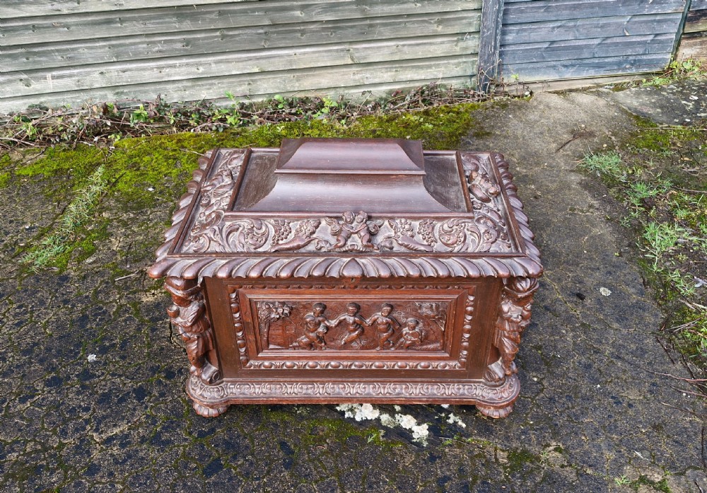 Mid 19th century carved oak wine cooler.  View IX