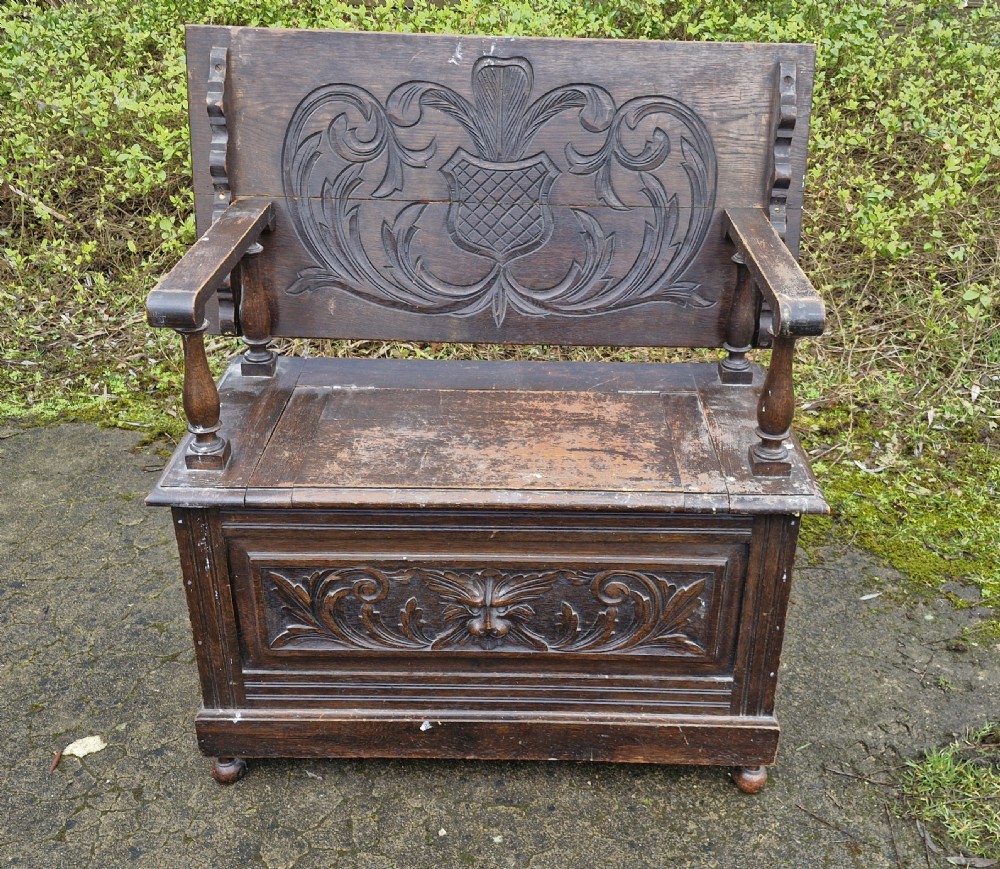 Late Victorian carved oak Green Man monks seat. View II