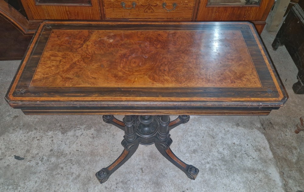Victorian walnut and coromandel games table. 