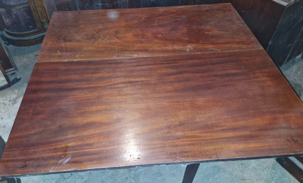 Useful and practical early 19th century mahogany drop flap dining table.  View VI