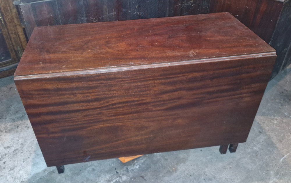Useful and practical early 19th century mahogany drop flap dining table.  View VII