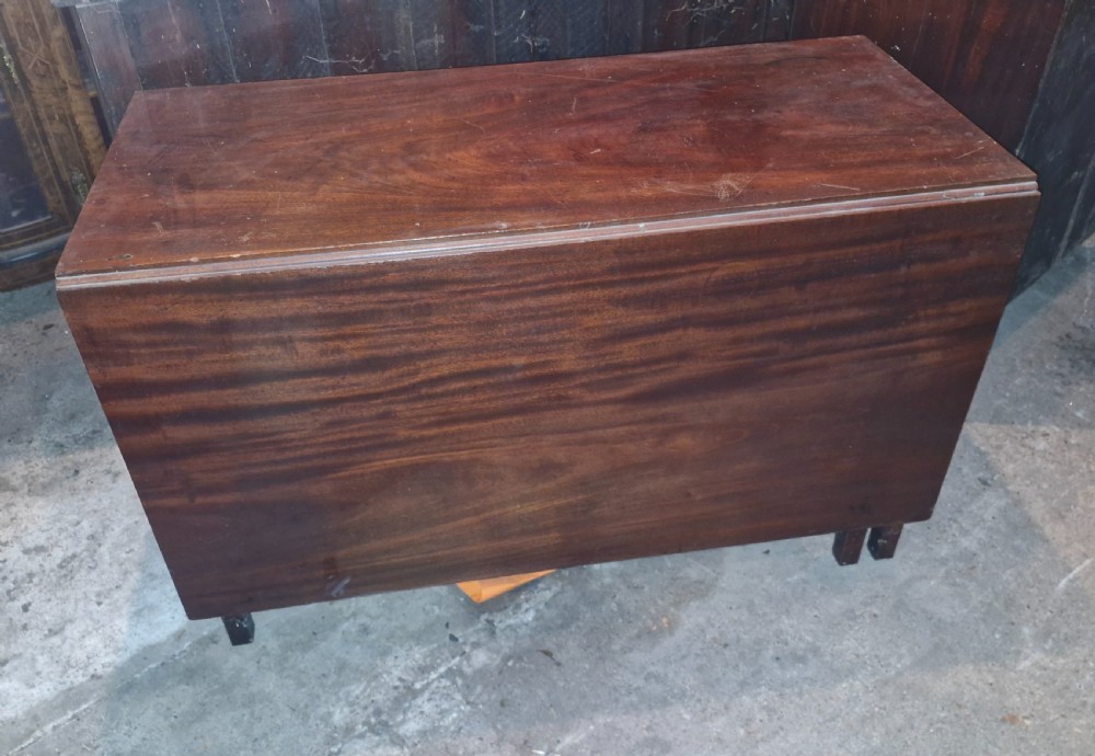 Useful and practical early 19th century mahogany drop flap dining table.  View IX