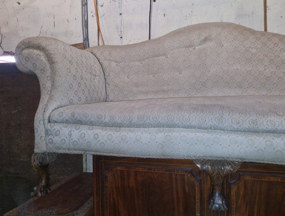 Edwardian upholstered camel Back Sofa on ball and claw feet.  View IX