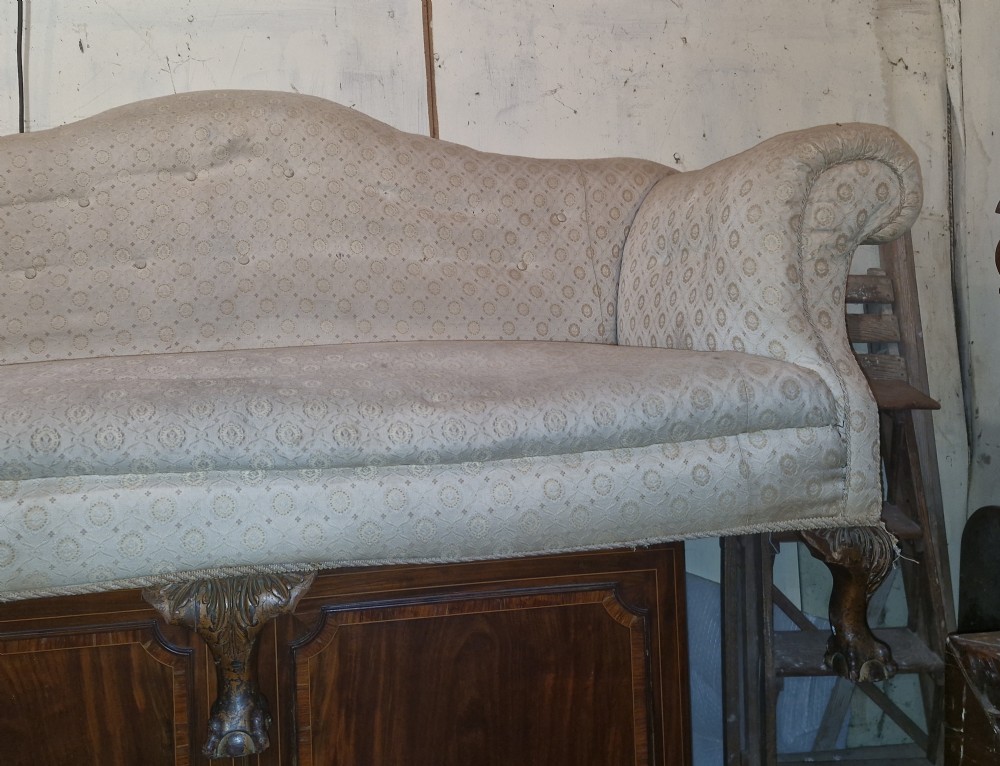 Edwardian upholstered camel Back Sofa on ball and claw feet.  View X
