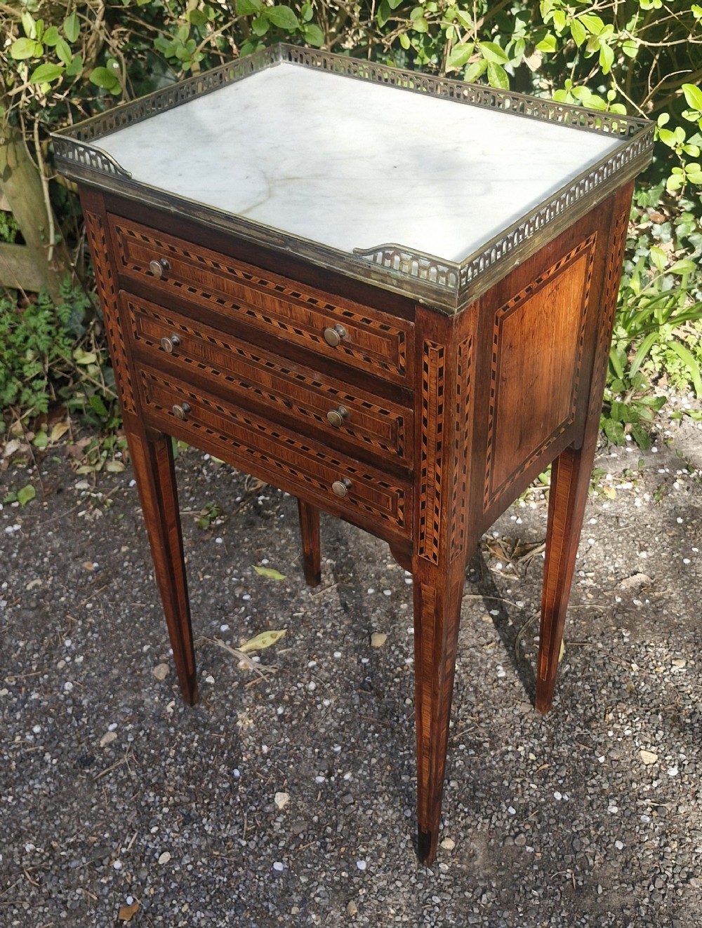 Marble top 3 drawer inlaid bedside chest.