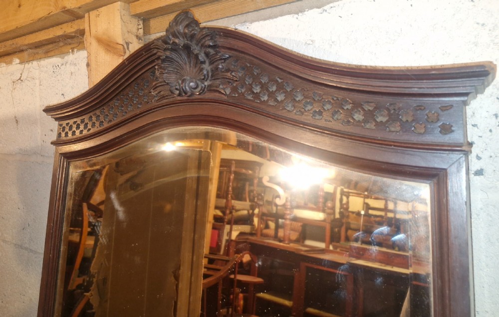 A late Victorian dark mahogany dressing table featuring a tall central mirror, carved top pediment, attached side cupboard with brass mounts, and a lower wide drawer. View VI