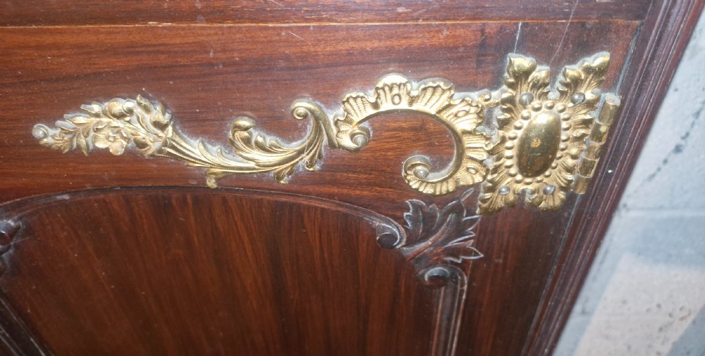 A late Victorian dark mahogany dressing table featuring a tall central mirror, carved top pediment, attached side cupboard with brass mounts, and a lower wide drawer. View VIII