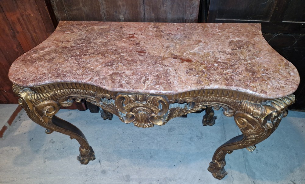 Marble top carved gilt wood hall table.