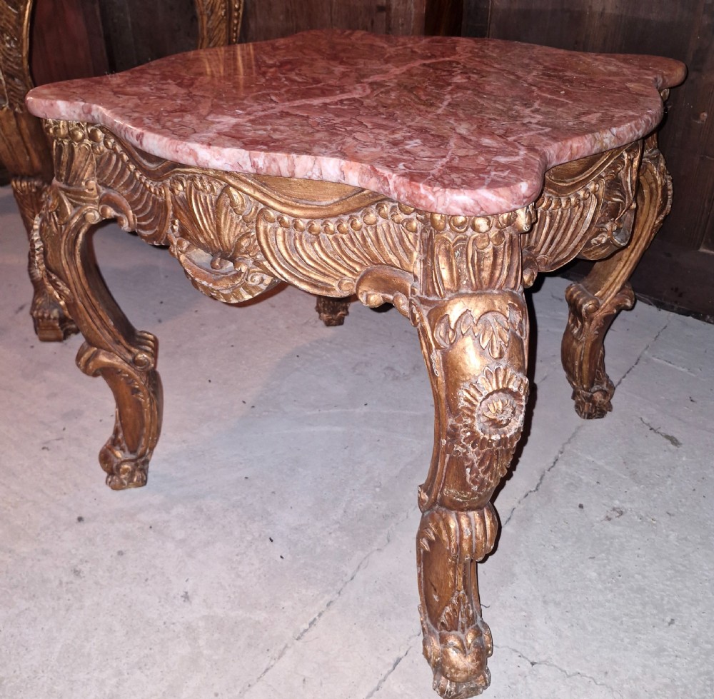 Marble top carved gilt wood occasional table. 