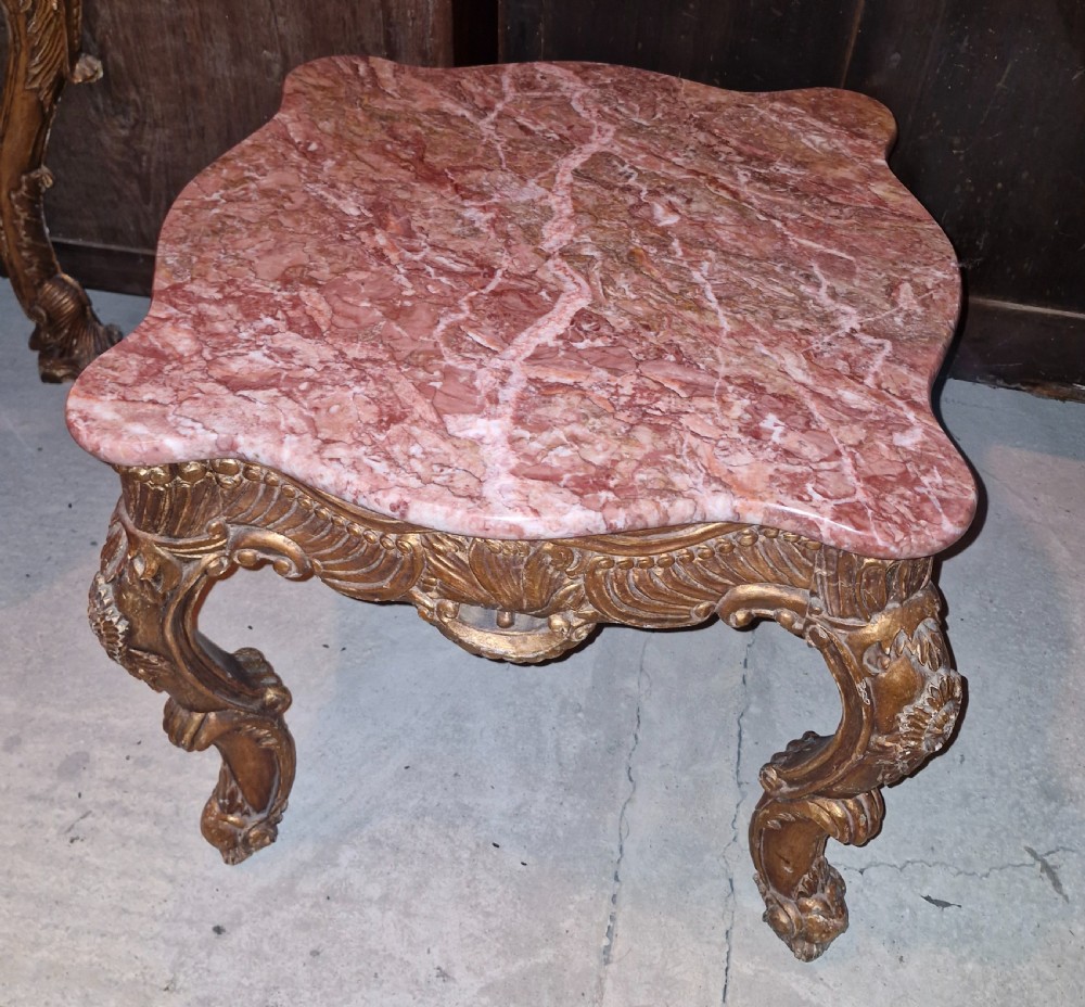 Marble top carved gilt wood occasional table.  View IV