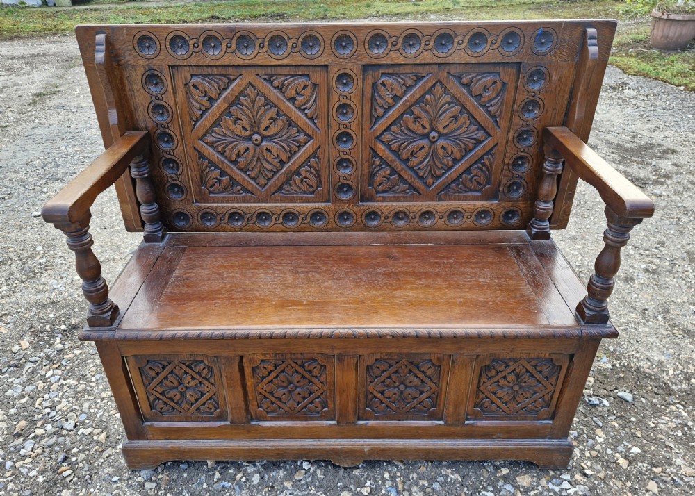 Carved oak box seat monks bench 