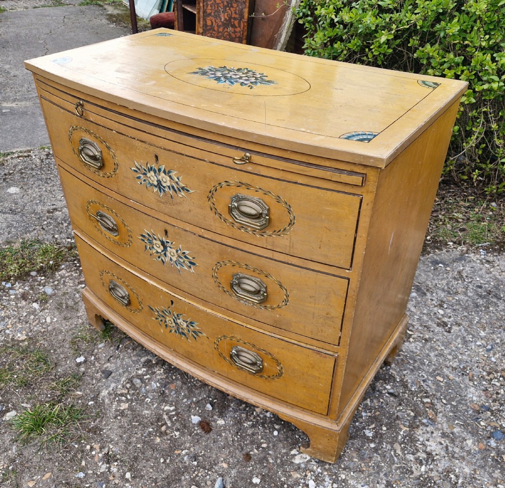Pretty original painted bow front chest with brushing slide. View VII