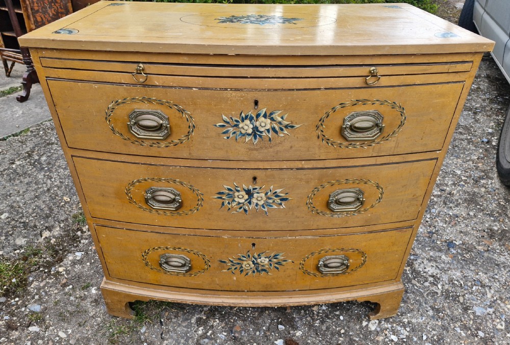 Pretty original painted bow front chest with brushing slide. View X