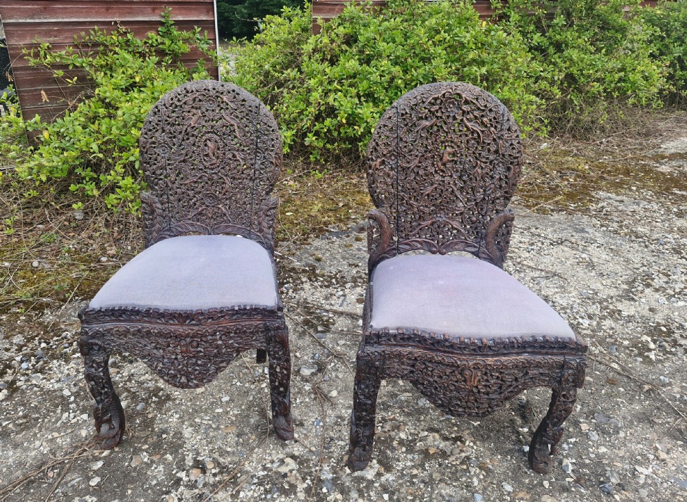 Pair of carved Burmese side chairs 