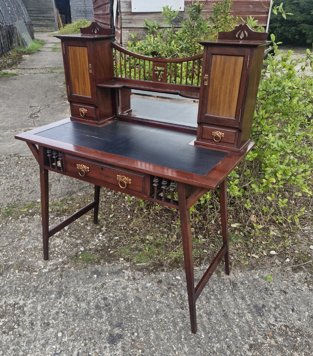 Mahogany writing table by Shapland & Petter.  View VI