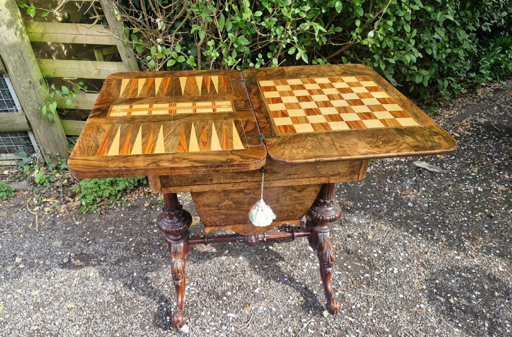 Mid Victorian walnut combined work and games table of good size.