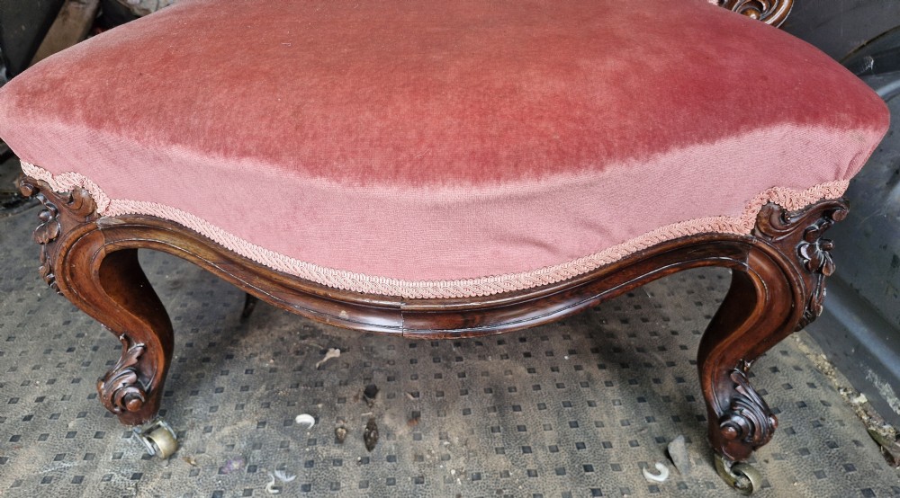 Mid 19th century rosewood upholstered chaise longue.  View X