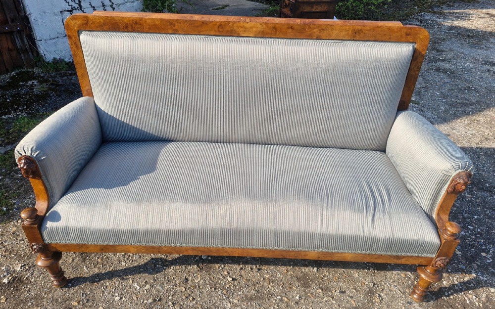 Walnut framed upholstered hall sofa.