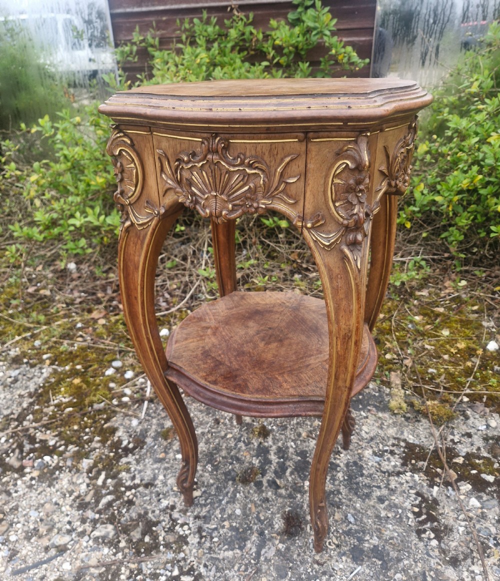 Late 19th century walnut and gilt heightened 2 tier table. 