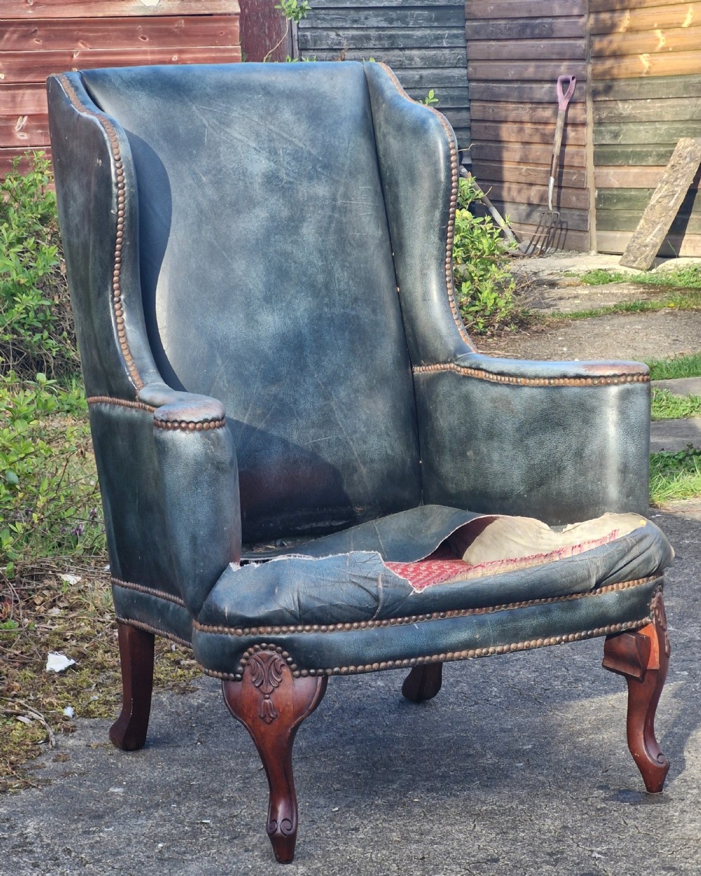 Upholstered wing back armchair. 