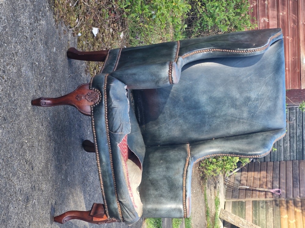 Upholstered wing back armchair.  View II