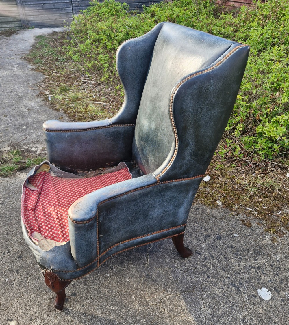 Upholstered wing back armchair.  View VII
