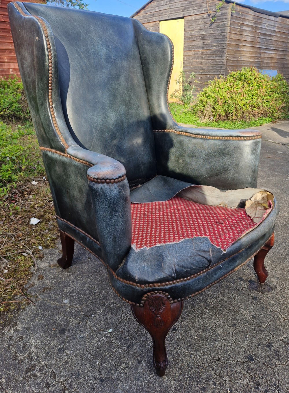 Upholstered wing back armchair.  View IX