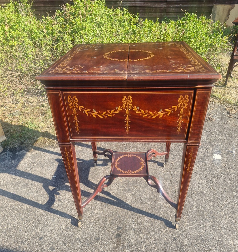 Edwardian inlaid mahogany surprise drinks table.