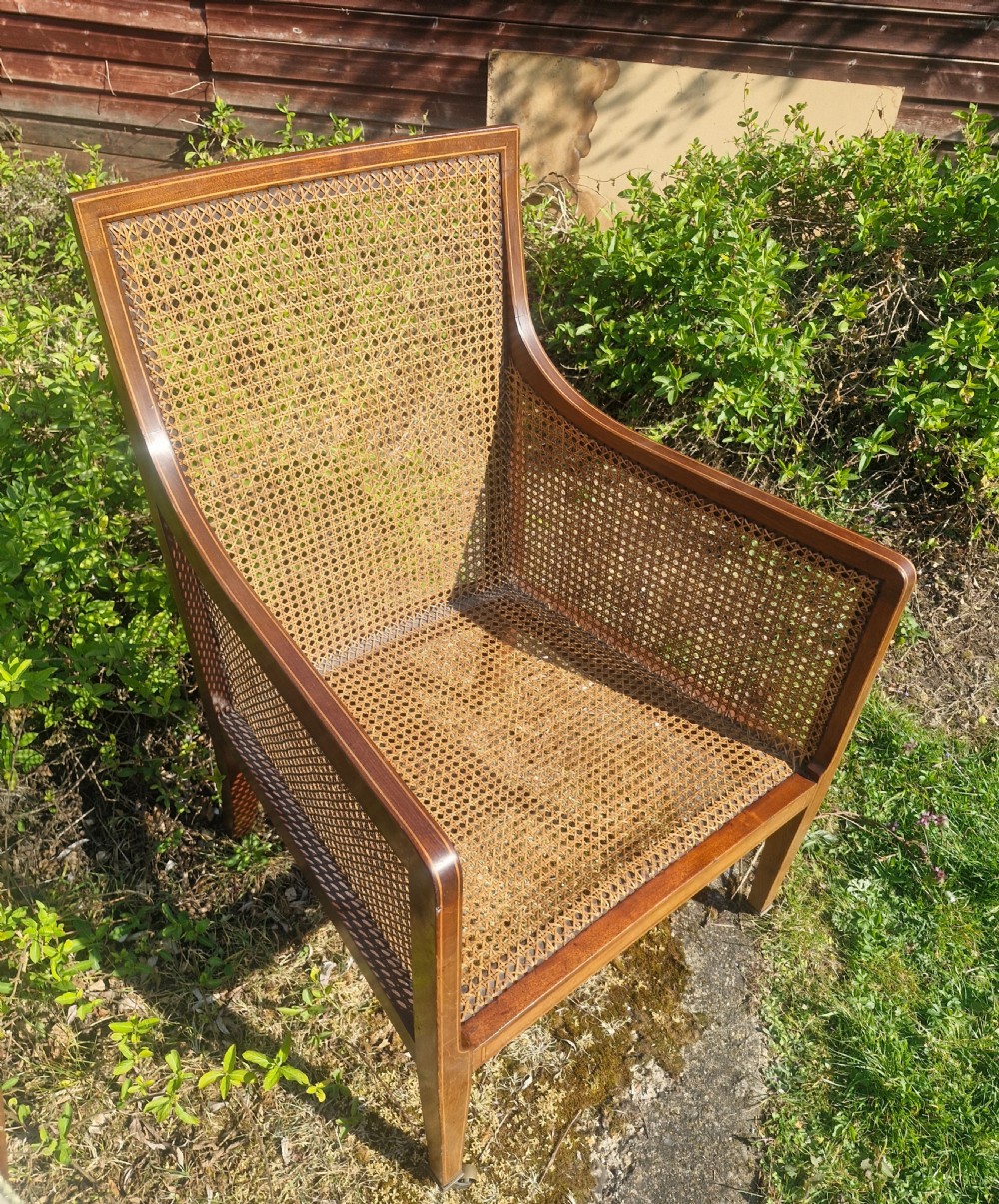 Edwardian inlaid mahogany bergere armchair. 