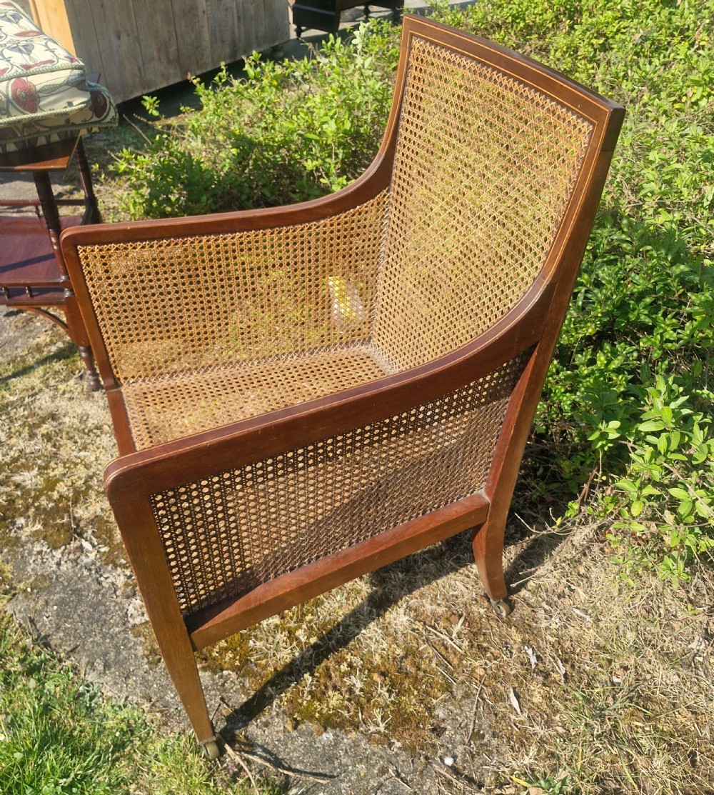 Edwardian inlaid mahogany bergere armchair.  View III