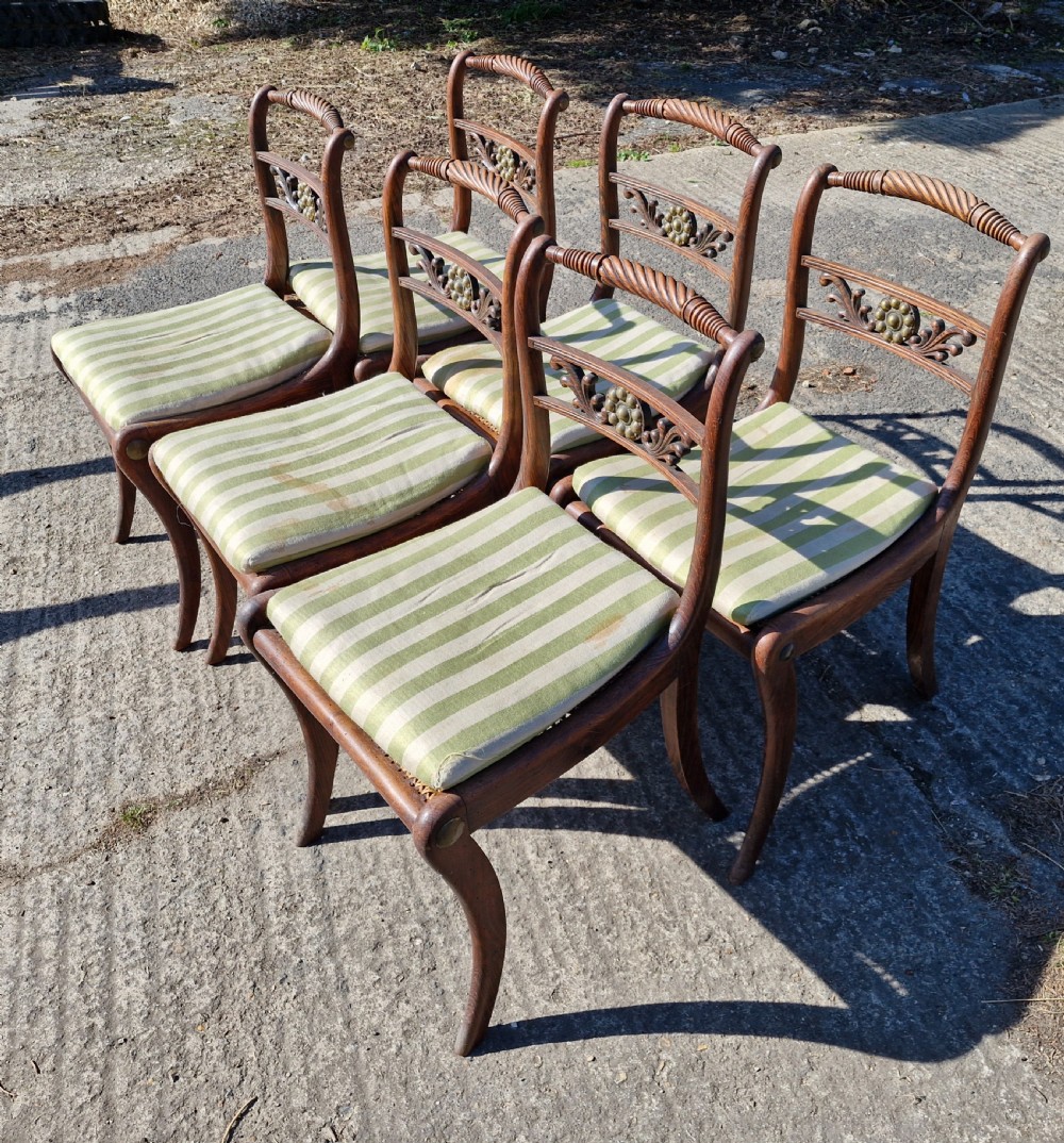 Set of 6 simulated rosewood dining chairs with metal mounts and original squabs. View VII