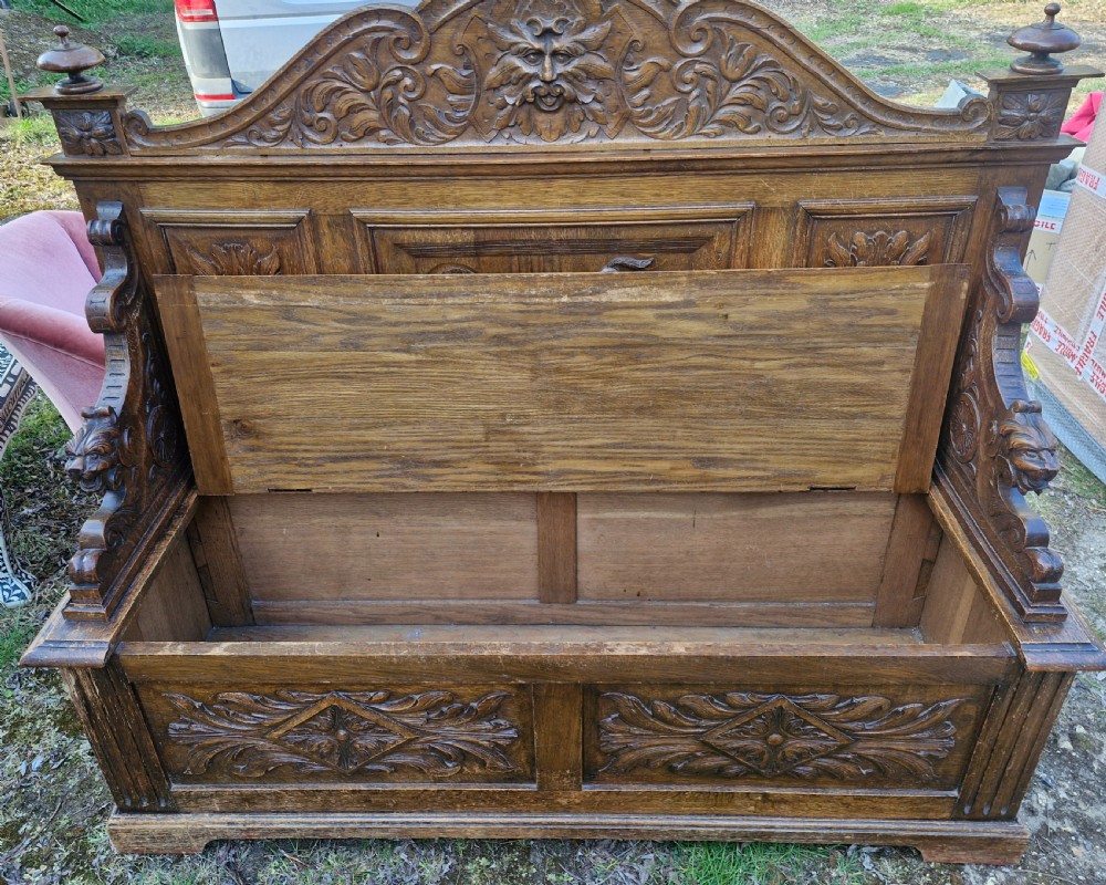 Late Victorian carved oak hall seat with storage seat. View V