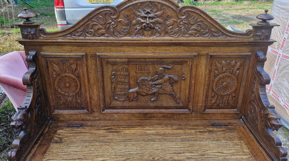 Late Victorian carved oak hall seat with storage seat. View VI