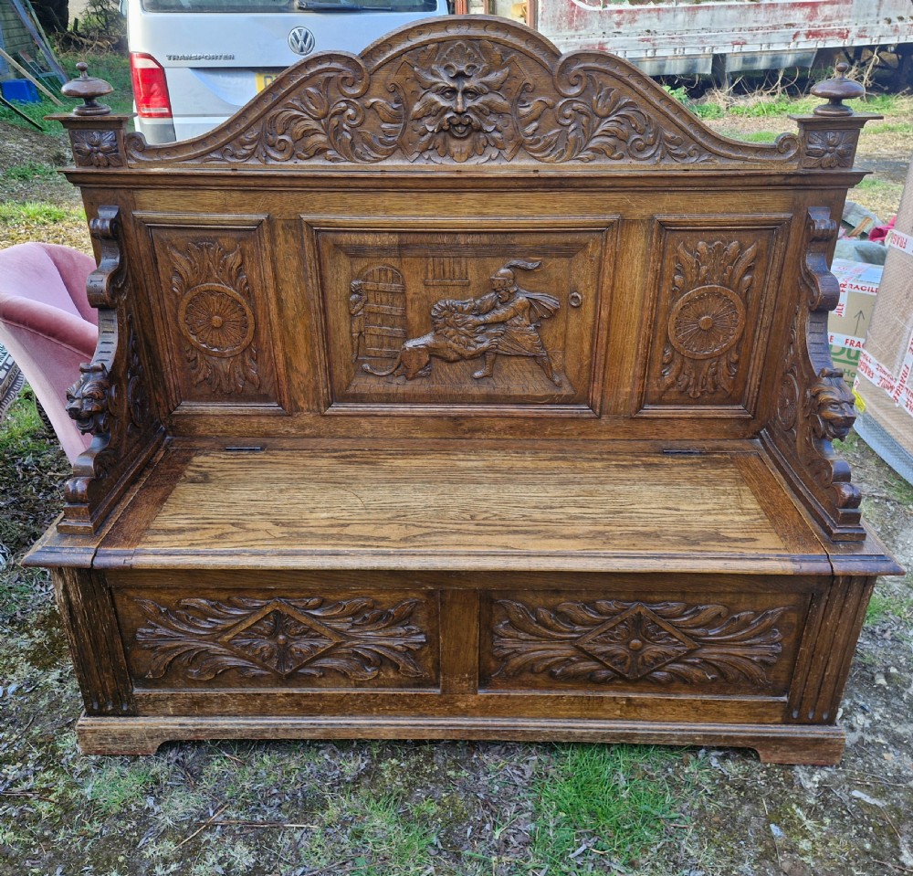 Late Victorian carved oak hall seat with storage seat. View VII